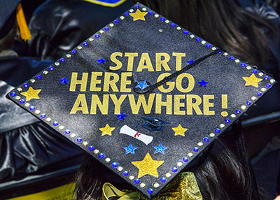 Graduation Cap decorated with Start Here. Go Anywhere.
