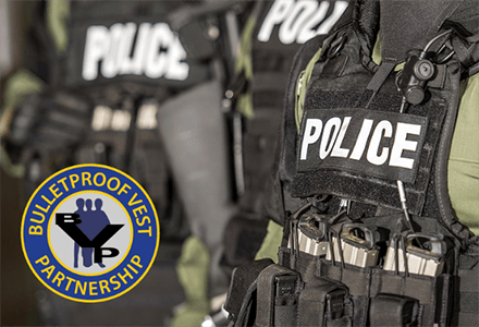 Bullet proof vest partnership logo on policeman vest